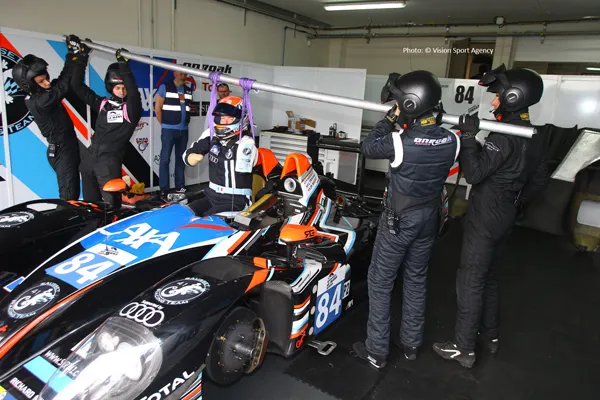 Frédéric lifted into motorcar